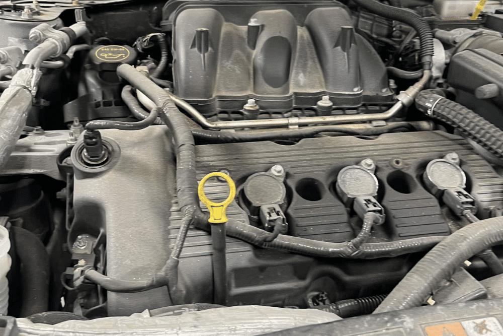 Engine Repair by Promex Auto in Newport, NH, Technician diagnosing engine overheating issue